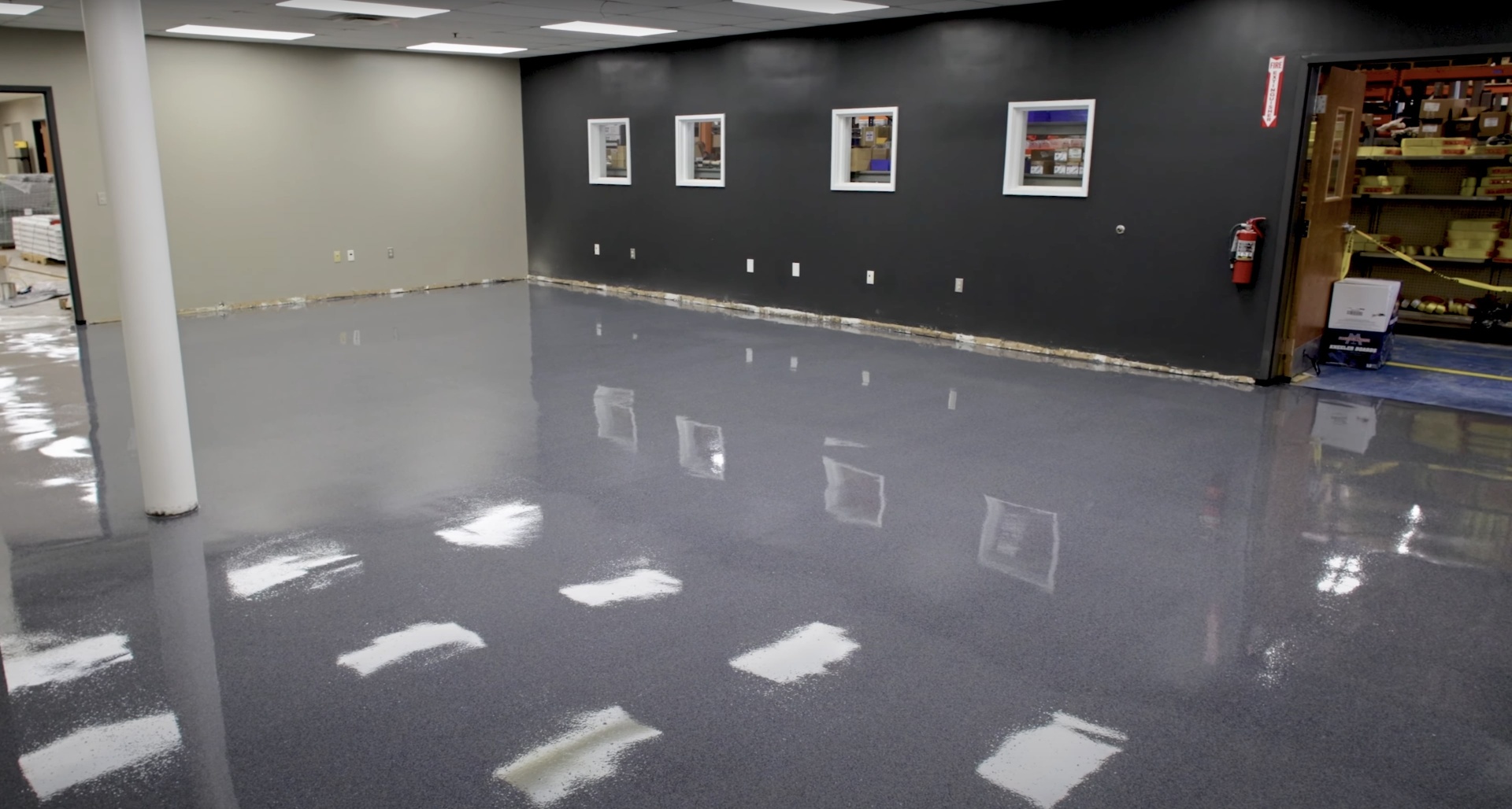 Polished commercial concrete floor with high-gloss finish in business setting